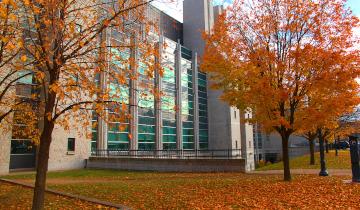 The outside of Stauffer library in the Fall