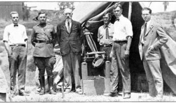 Professor S. A. Mitchell (second from right) and his son, A. C. G. Mitchell (far left), with colleagues from the Paris Observatory and University of Virginia observe the 1923 total eclipse near San Diego, California.