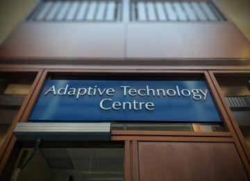 Photo of the Adaptive Technology sign above the entrance to the room.