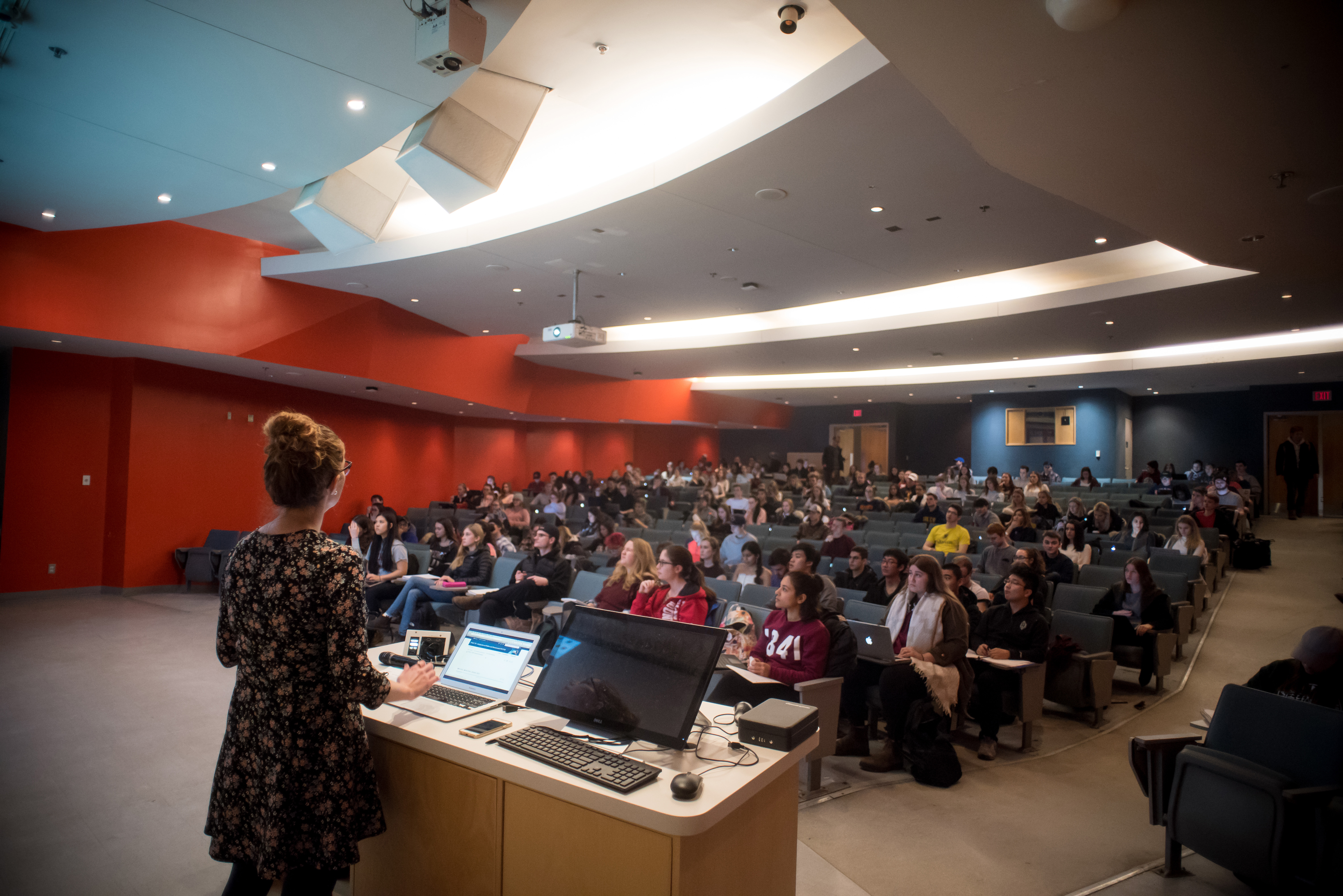 view of a lecture hall from behind lecturer.