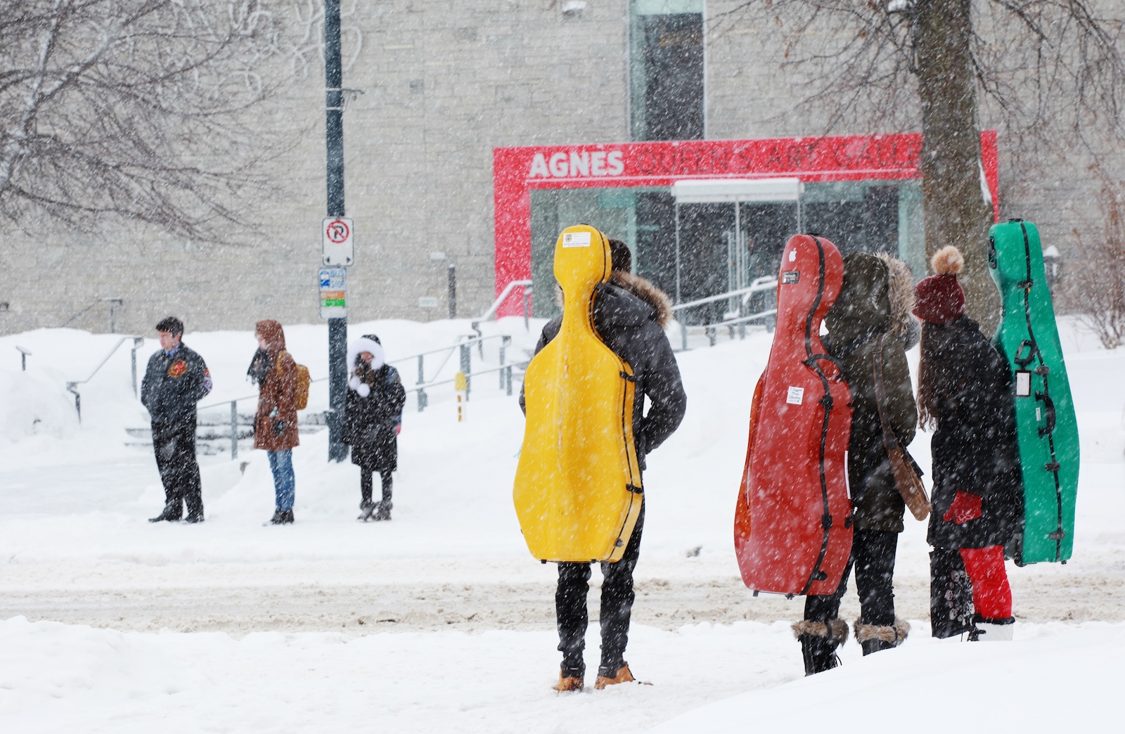 Students with cellos outside in winter