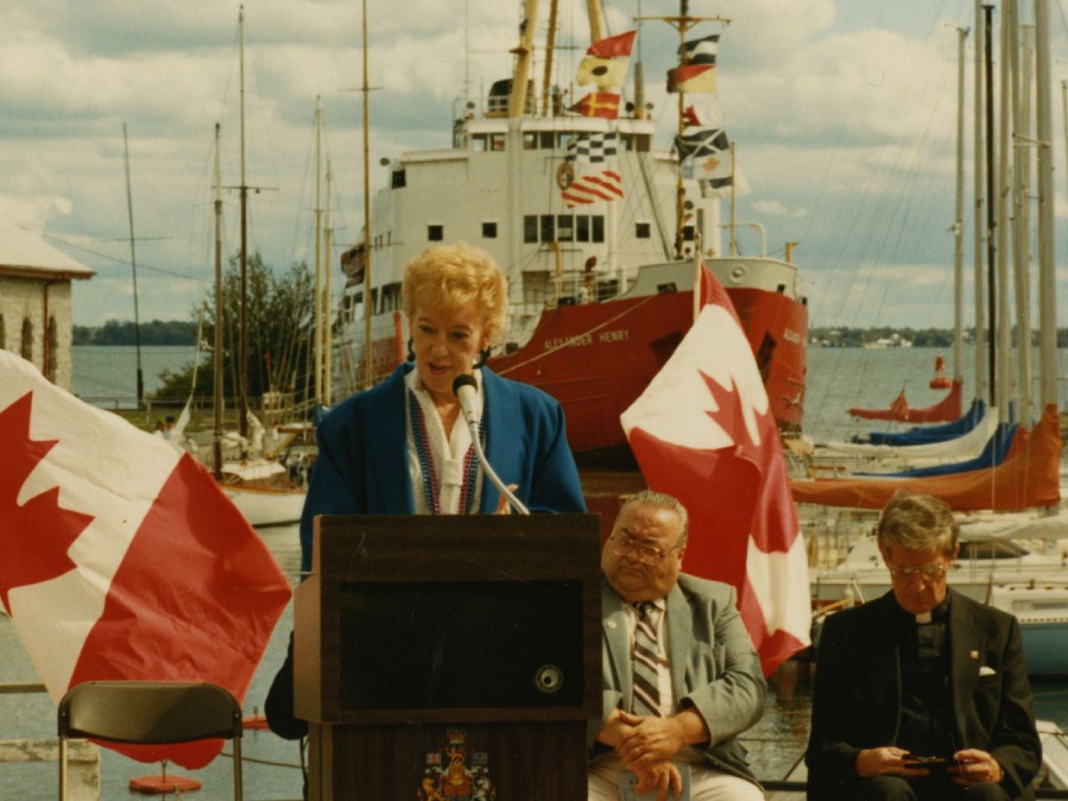 photograph taken during the plaque unveiling ceremony commemorating Kingston Dry Docks. Flora MacDonald is identified.