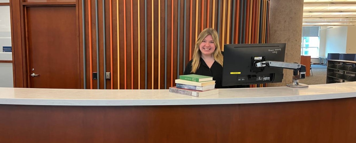student at stauffer information services desk