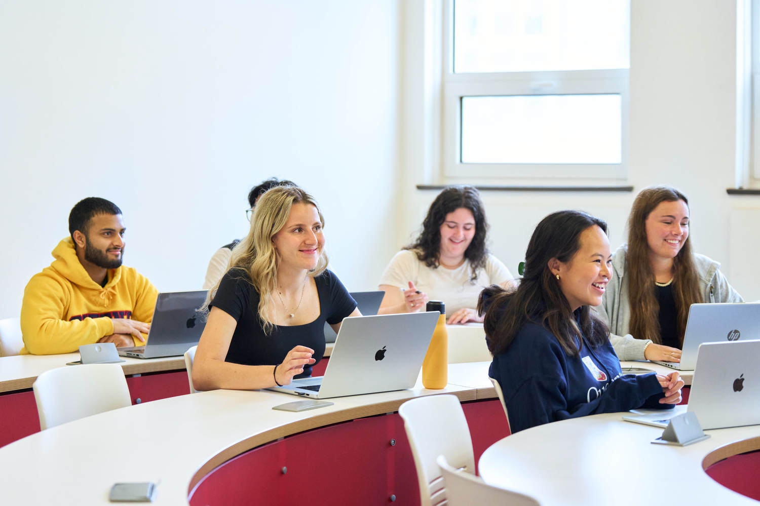 students at desks listening attentively
