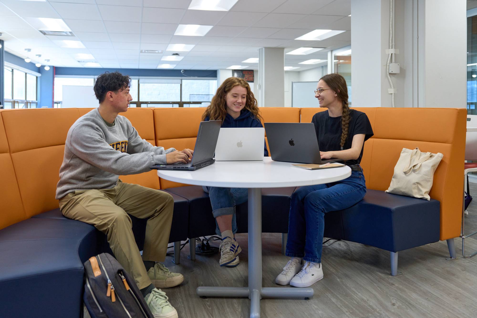 students working together on a laptop
