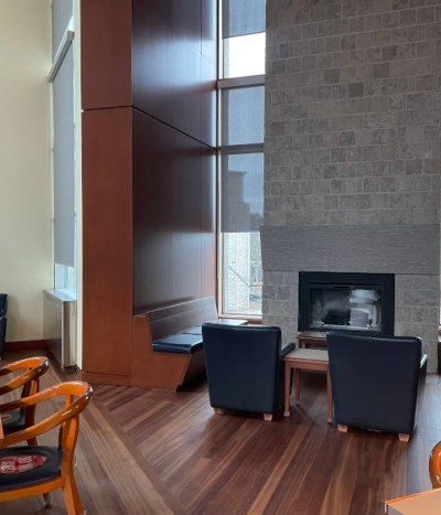 Interior view of chairs and fireplace in the Alan G. Green reading room