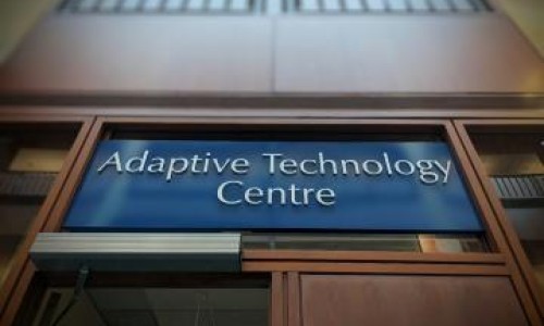 Photo of the Adaptive Technology sign above the entrance to the room.