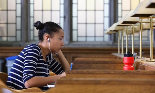 a student studying in Douglas Library