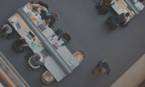 students in library shot from above