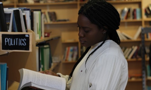 a woman browses books